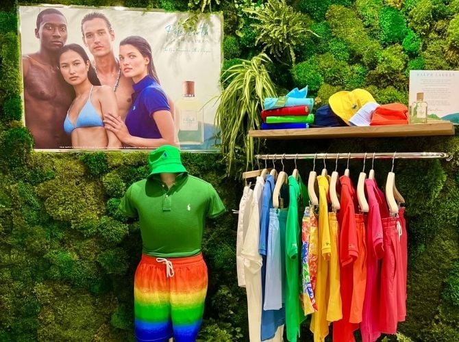 Clothing display in Ralph Lauren store with moss wall background