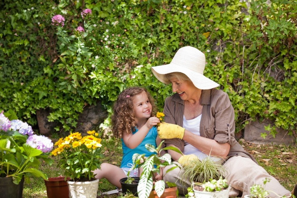 GrowUp Vertical Farming | grandmother and granddaughter gardening 